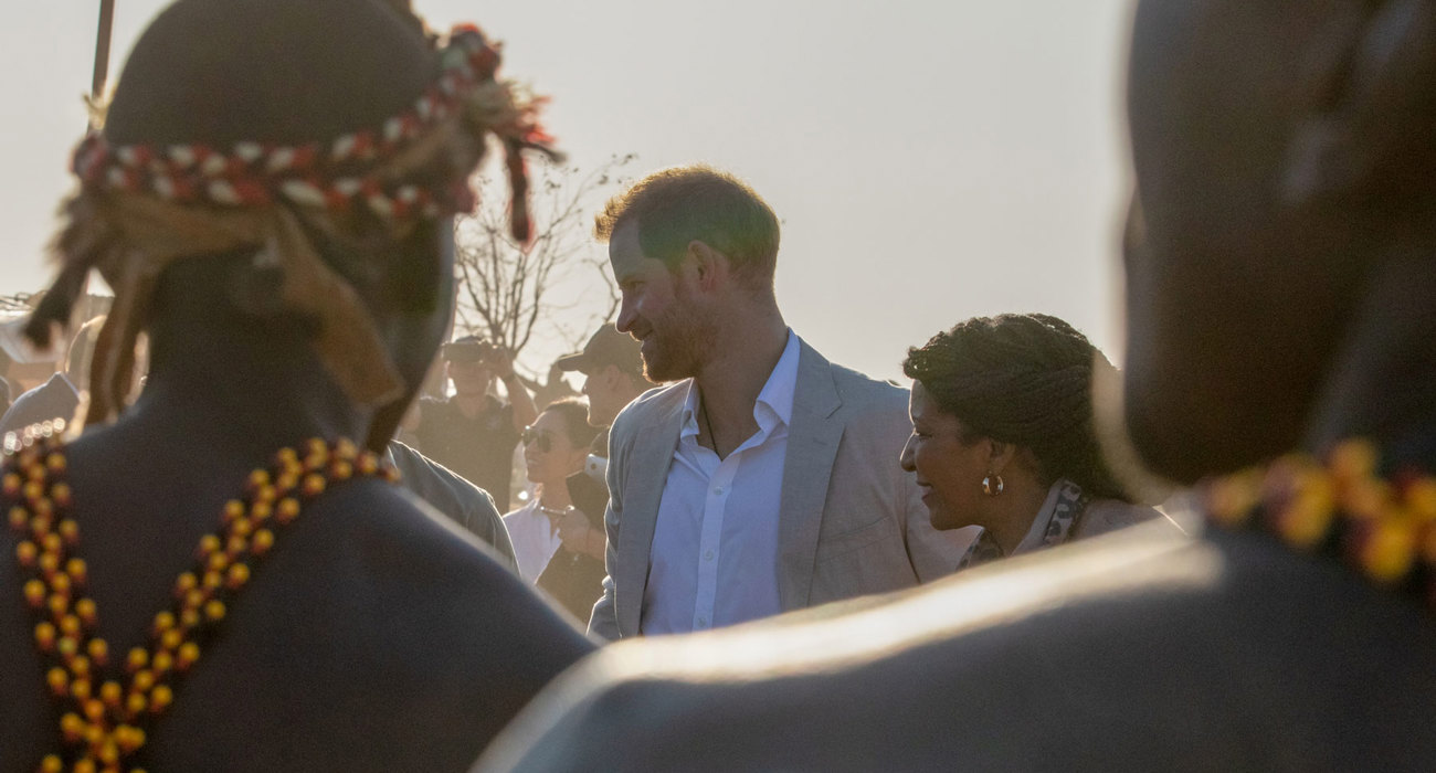 Prince Harry is greeted by local dancers during his visit to a HALO Trust site in Angola