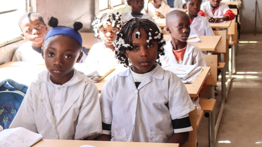 Children sit in a classroom at Kambulukuto School, Cuito, Angola