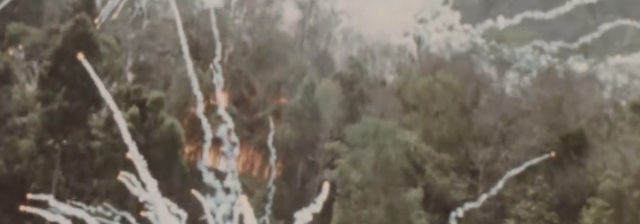 Archival footage showing bombs being dropped in Laos
