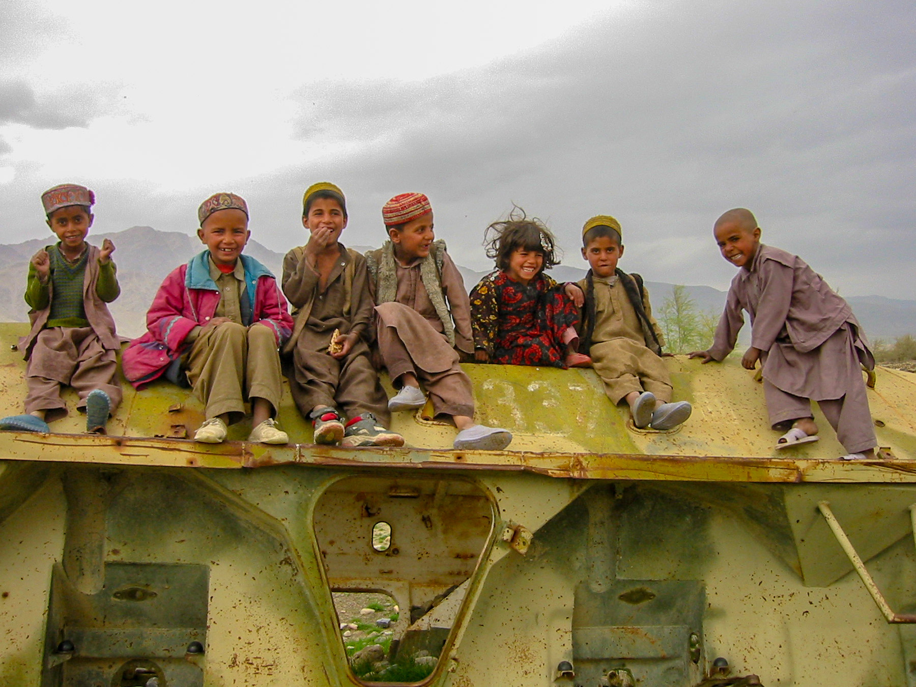Children sitting and smiling in Afghanistan