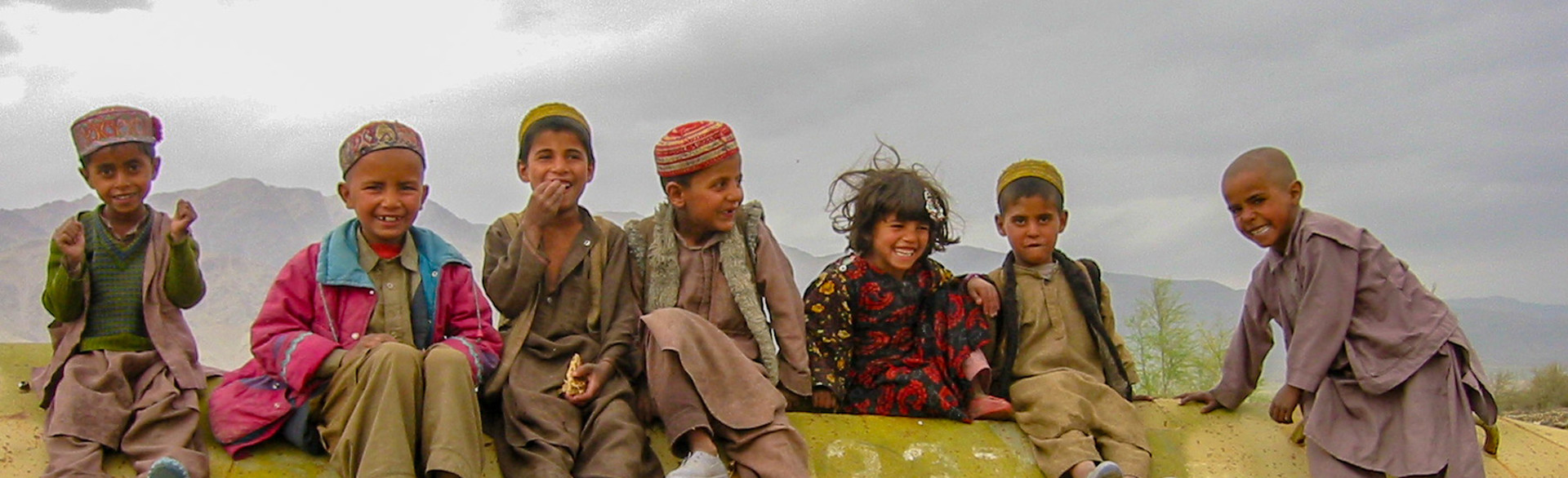Children sitting and smiling in Afghanistan