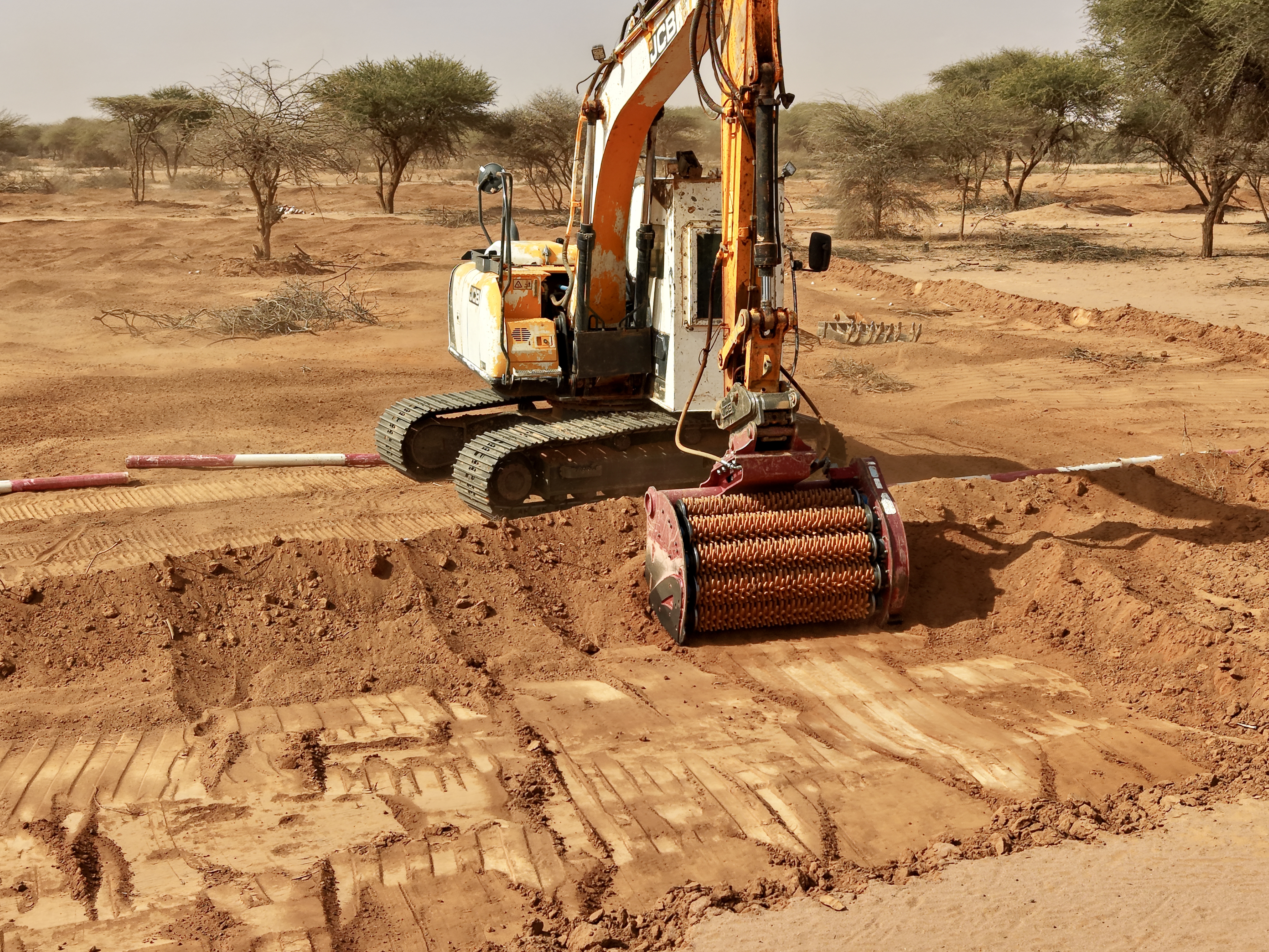 A large digger truck creates a deep trench in Somalia