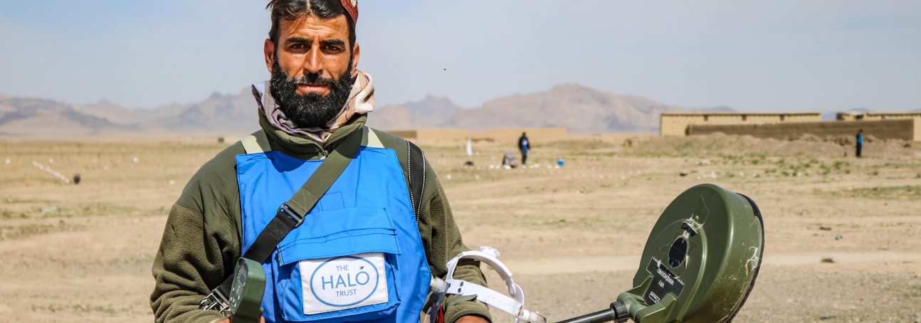 HALO Deminer in Afghanistan, holding a metal detector