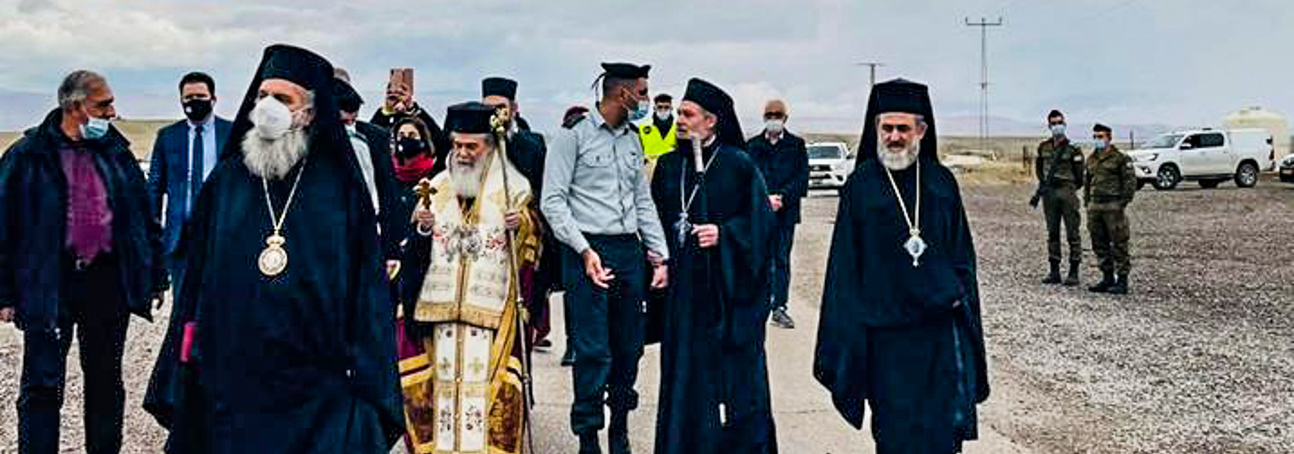 A group of religious leaders participating in a ceremony at the baptism site, now cleared of landmines by The HALO Trust 