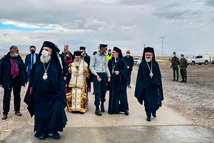 A group of religious leaders participating in a ceremony at the baptism site, now cleared of landmines by The HALO Trust 