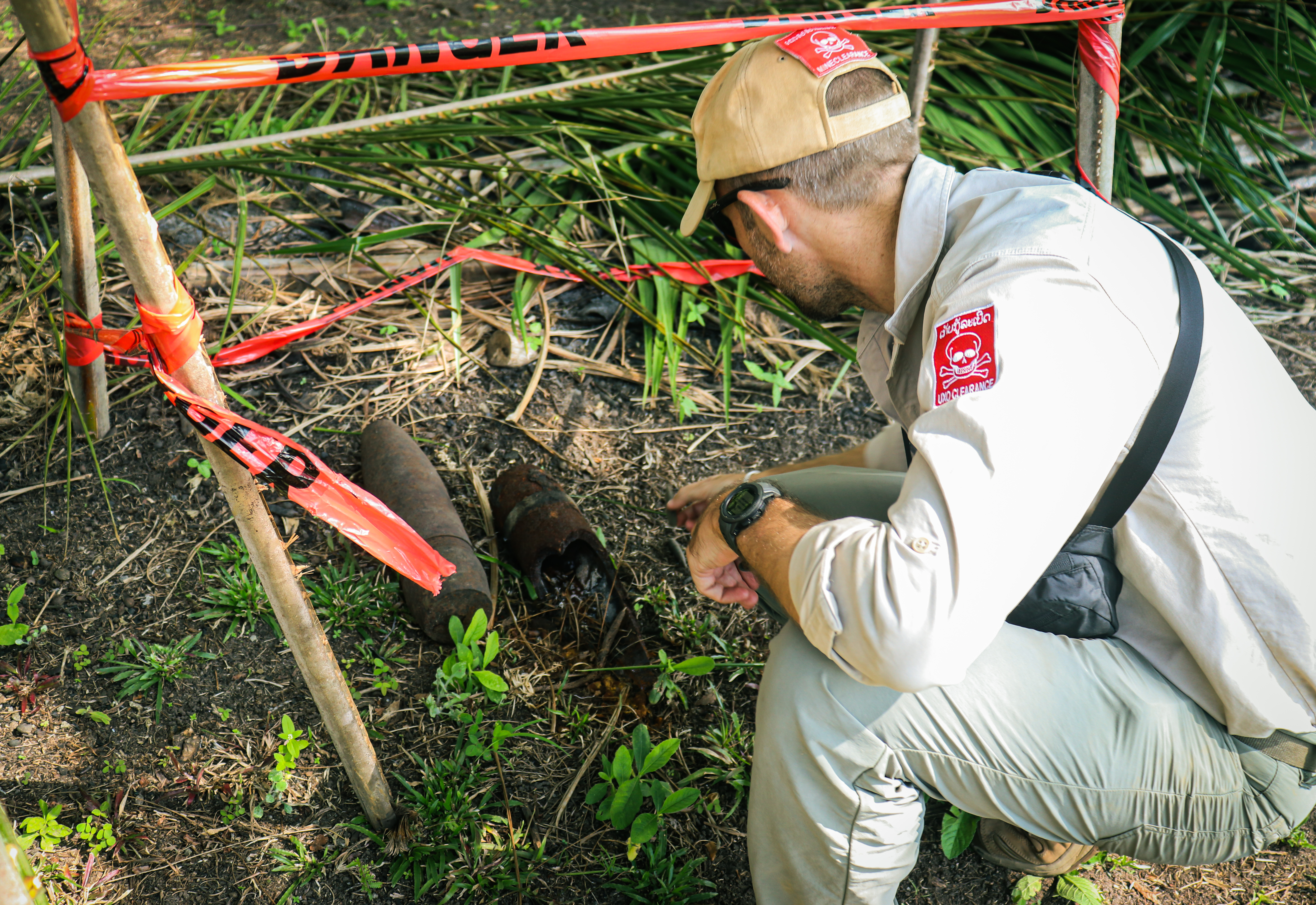 A man inspects explosive devices