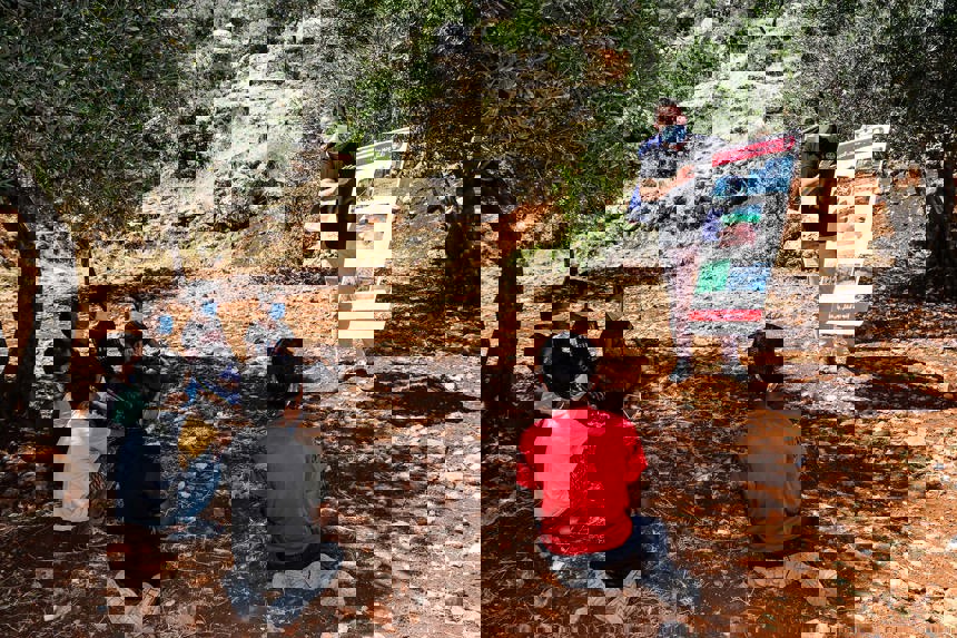 Children receiving an explosive ordnance risk education session in Syria