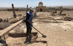 A HALO Trust deminer carefully uses a detector in the Franciscan Compound