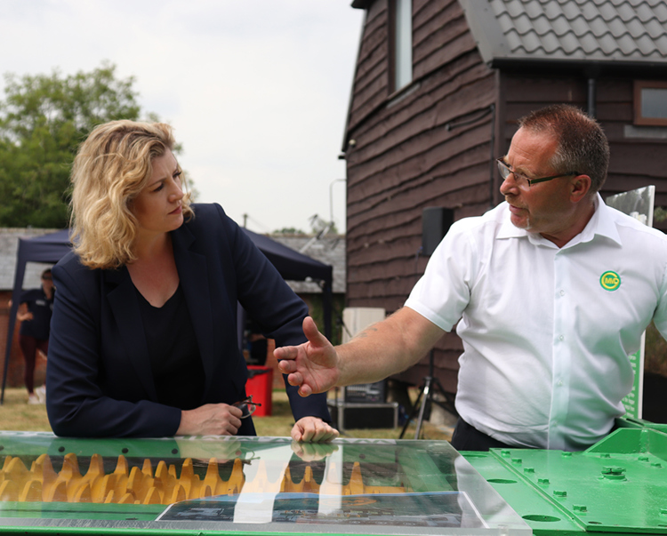 A Cobham engineer demonstrates a new piece of equipment for Penny Mordaunt during a visit