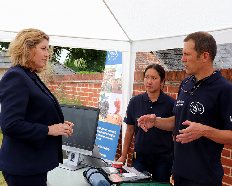 Penny Mordaunt talking with two members of HALO's Medical Board during a visit to the HALO Office