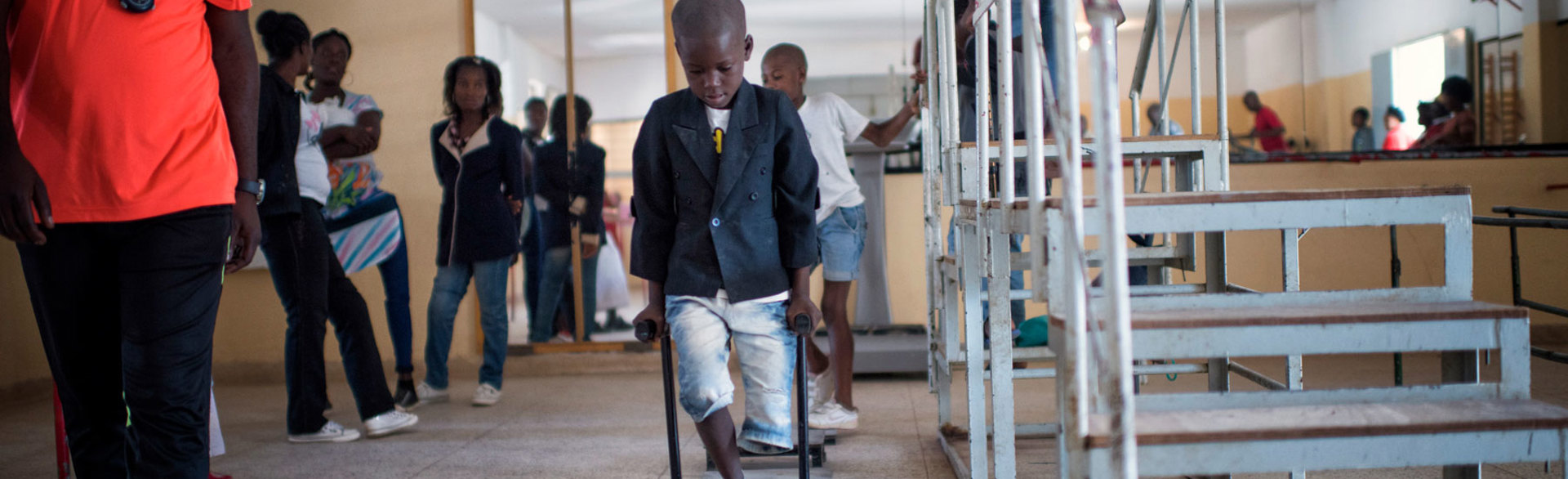 Manuel Huambo, an eight year old boy, takes part in a rehabilitation session following the loss of his leg