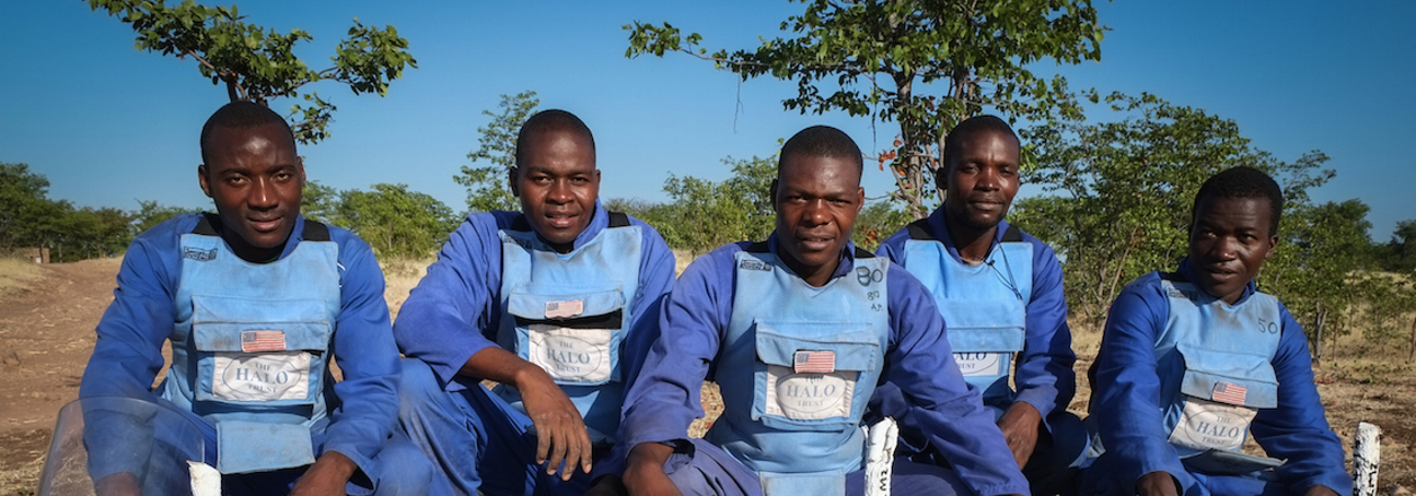 A team of deminers wear uniform and PPE in Zimbabwe