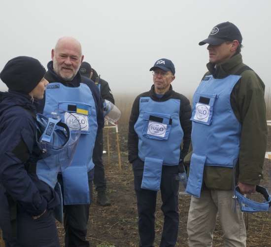John Jameson, James Cowan and halo staff members stand in a cold Ukrainian minefield